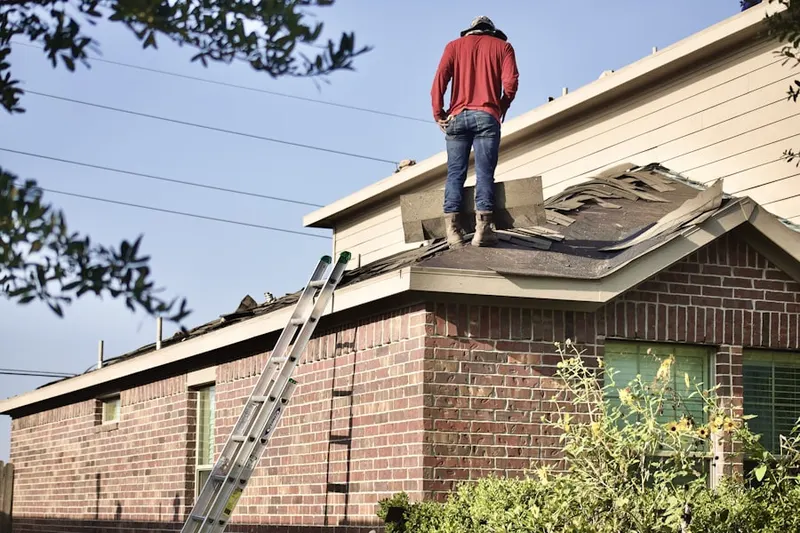 Professional roofer working on a residential roof in Blue Bell